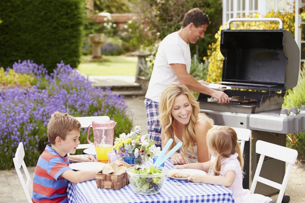 Northern Kentucky family enjoying a barbecue outside